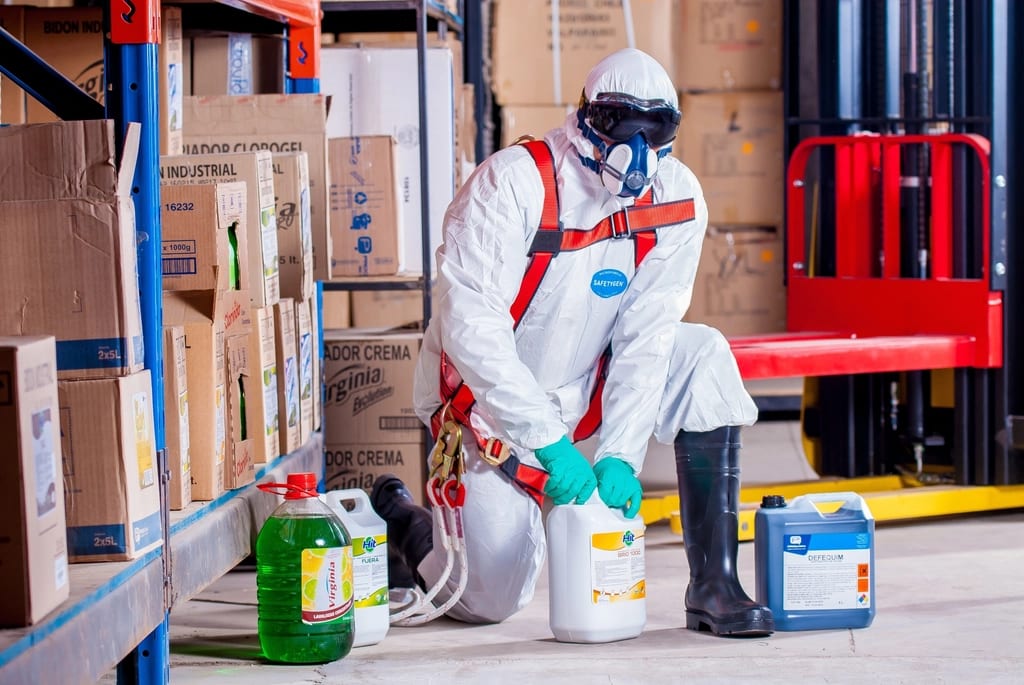 Infectious disease cleanup specialists in protective gear